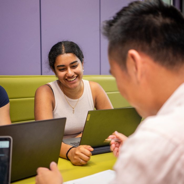 A group of students using laptops while studying indoors on UNSW Kensington Campus