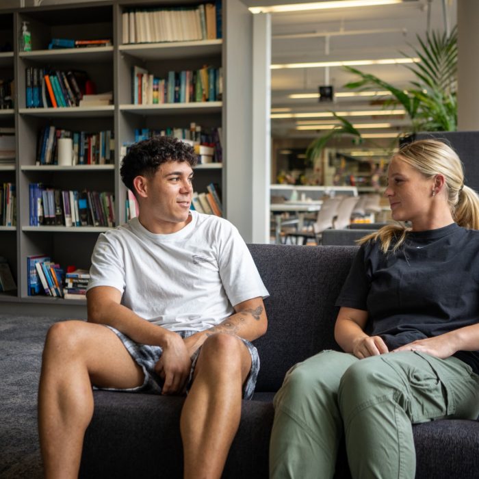Two students sitting on a sofa in Nura Gili on Kensington Campus