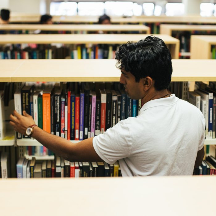 Students browsing books in the main library