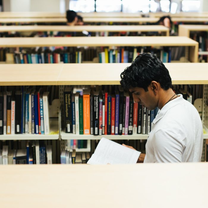 Students browsing books in the main library