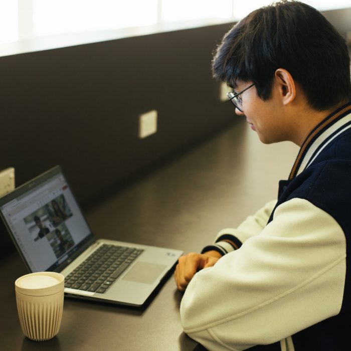 Student on a teams video call on their laptop
