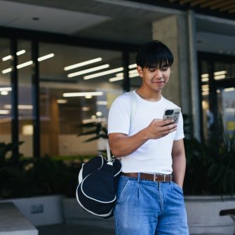 Student looking at their phone on Paddington Campus