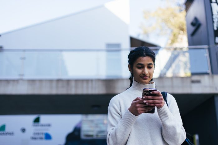 Student looking at their phone on Paddington Campus