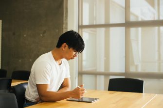 Photo of a student using a tablet in class