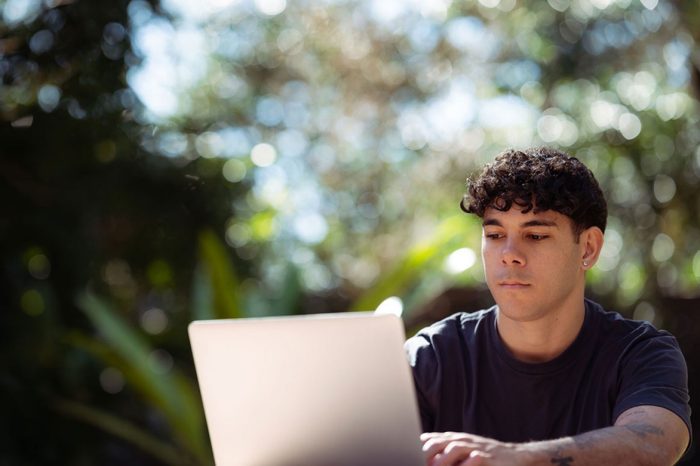 Indigenous student on laptop
