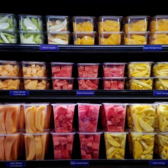 Fresh cut fruit in plastic containers in local supermarket