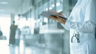 Healthcare and medicine. Medical and technology. Doctor working on digital tablet on hospital background