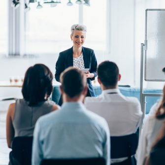 Businesswoman leading a training class for professionals