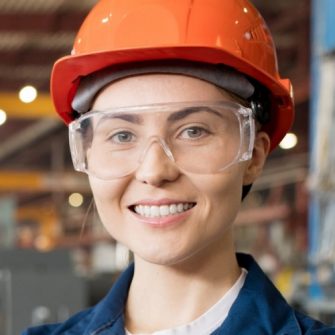 Female Engineer smiling on site at factory