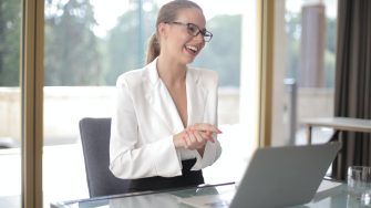 Woman laughing in a conference call