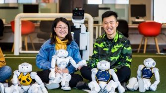 Two students involved in a robotics engineering competition