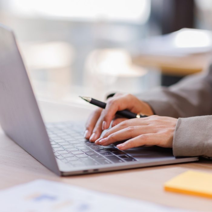 Person performing a student verification request on a laptop computer