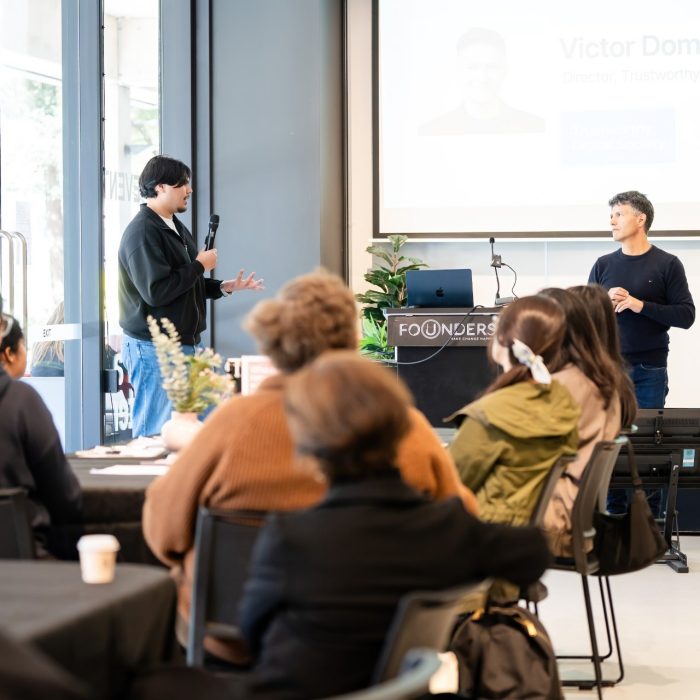Two presenters speaking to seated attendees at the UNSW–UTS TDS Student Forum.