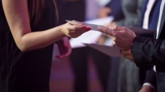 Student receiving a certificate at an award ceremony