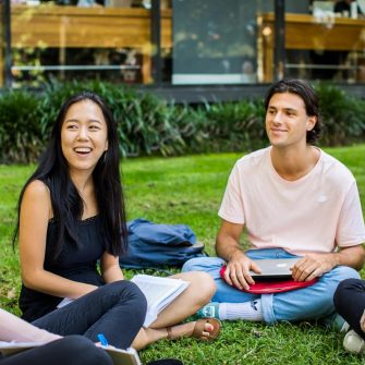 UNSW students sitting outdoors