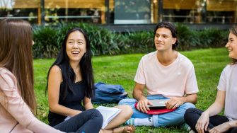 UNSW students sitting outdoors