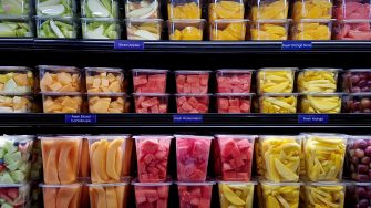 Fresh cut fruit in plastic containers in local supermarket