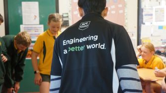 The back of an EWB team member shirt that reads " Engineering a better world".