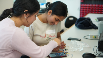 Two students in an engineering workshop