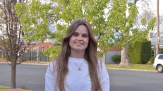 Woman standing and looking at the camera