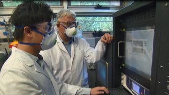 Professor Guan Yeoh (Director) and Dr Anthony Yuen (Centre Manager) operating the cone calorimeter equipment to characterise the burning and flammability behaviour of solid materials.