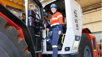 Lucy Barrie in High Vis Clothing Climbing into a large Truck