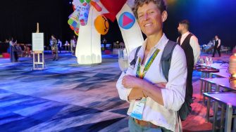 PhD student posing at sydney worldpride conference