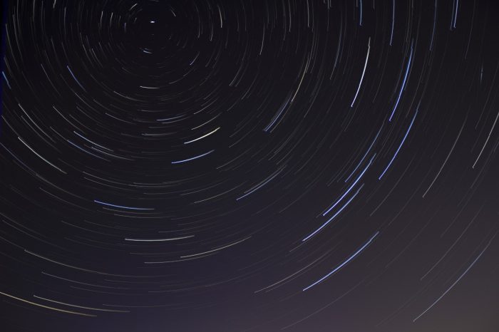 A time lapse photo of a starry sky
