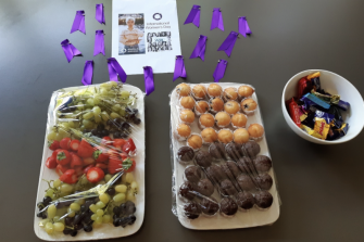 a picture of fruits, sweets with a flyer on a table