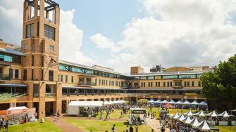 UNSW Sydney campus courtyard with festival tents and crowds during O-Week.