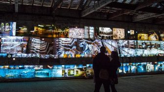 Couple looking at digital screens