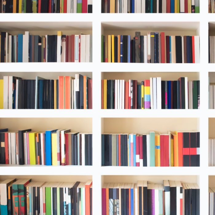 Library wall full of mult-coloured books