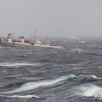 ship breaching ocean during a storm