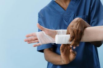 Nurse treating a wrist injury