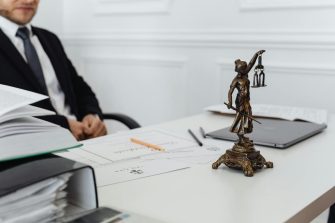 Man at desk with paper weight