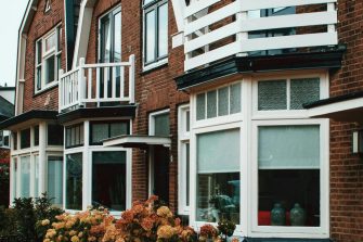 Red brick house outside view with windows