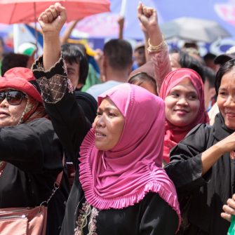 Filipino Muslims women from different part of the nation join peace rally near the presidential palace as a peace pact is signed between the Philippine government and the secessionist Moro Islamic Liberation Front (MILF)