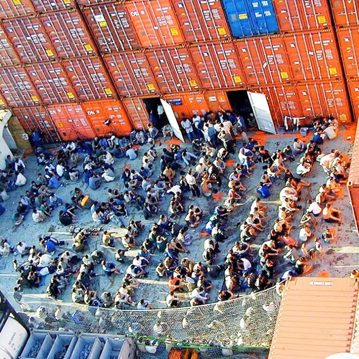 Christmas Island, August 29, 2001. Handout picture of some of the 438 asylum seekers onboard the Norwegian cargo ship MS Tampa on Monday 27th August, 2001. The boat people where rescued from their sinking ferry in international waters and remain onboard the ship which is anchored off Christmas Island. Australia refused the boatpermission to enter Australia's waters and Indonesia has since taken a similar stance. (AAP Image/Wallenius Wilhelmsen)