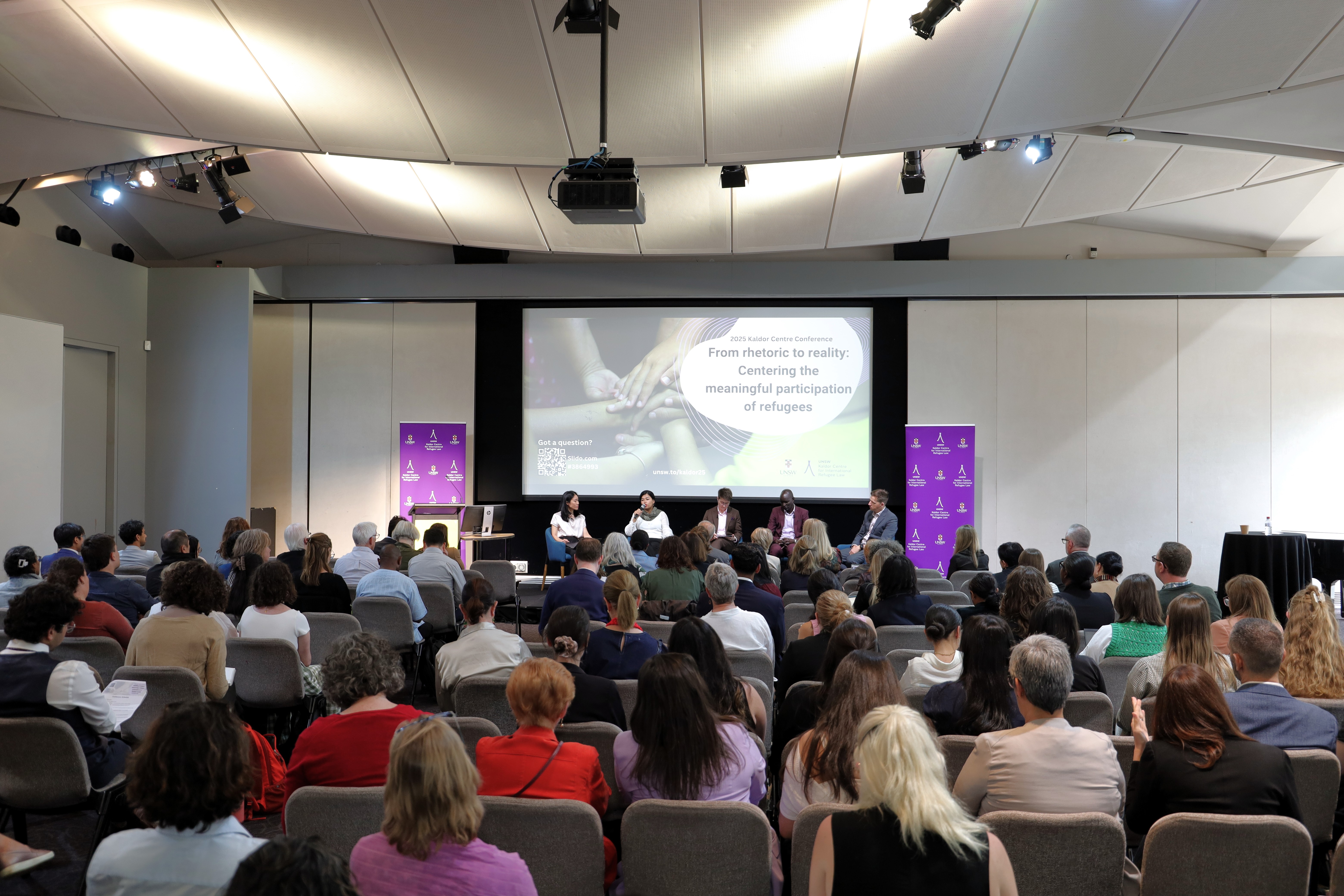 a man dragging a boat to the coast