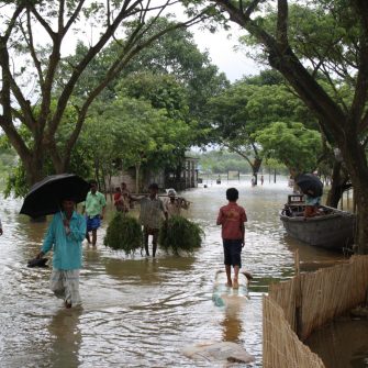 People walking in the flood