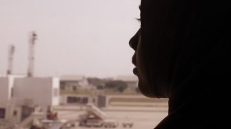 Muslim woman silhouette at the airport