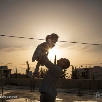 Thirty-seven-year-old Syrian refugee Mouhamad plays with his three-year-old daughter Yasmine Al Sham on the rooftop of their house in Barja, Lebanon. ; Wafaa Ahmad Hachem, 32, her husband Mouhamad Al Dali Al Masri, 37, their son Bakr, 13, and daughters, Layan, 10, Ghofran, 8, and Yasmine Al Sham, 3, come from the village of Gdaidet al Turkman in east Ghouta, just outside the Syrian capital Damascus. They fled to Lebanon in 2014, and are awaiting resettlement to Norway. The COVID-19 pandemic has suspended international resettlement for refugees worldwide, dividing some families and stranding them thousands of miles apart. UNHCR is concerned that international travel could increase the exposure of refugees to the virus. As resettlement remains a life-saving tool for many refugees, UNHCR is appealing to States to ensure that movements can continue for the most critical emergency cases wherever possible.
