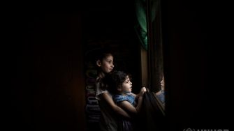 Ten-year-old Syrian refugee Layan plays with her three-year-old sister Yasmine Al Sham at their home in Barja, Lebanon. ; Wafaa Ahmad Hachem, 32, her husband Mouhamad Al Dali Al Masri, 37, their son Bakr, 13, and daughters, Layan, 10, Ghofran, 8, and Yasmine Al Sham, 3, come from the village of Gdaidet al Turkman in east Ghouta, just outside the Syrian capital Damascus. They fled to Lebanon in 2014, and are awaiting resettlement to Norway. The COVID-19 pandemic has suspended international resettlement for refugees worldwide, dividing some families and stranding them thousands of miles apart. UNHCR is concerned that international travel could increase the exposure of refugees to the virus. As resettlement remains a life-saving tool for many refugees, UNHCR is appealing to States to ensure that movements can continue for the most critical emergency cases wherever possible.
