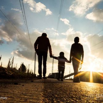 To the Unknown: It’s great to see my siblings going for a walk before sunset. When I took this picture from the side of the road, I felt a bit astonished… And I asked myself: When will we reach the end of the road? This road of which we can see no specific horizon…! ; My name is Hany. I am 20 years old. Two years ago, I arrived with my family in Lebanon from Homs.