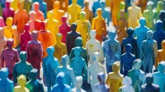 Multicoloured Wooden Figures Symbolizing Diversity and Community