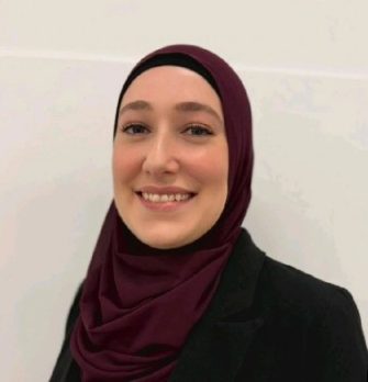 Woman looking into the camera smiling