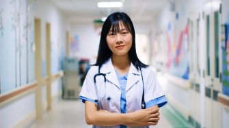 doctor posing in corridor