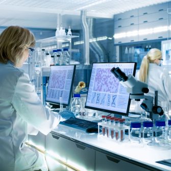 Photo of scientists working in modern laboratory