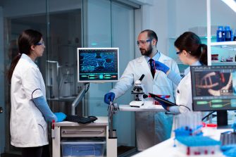 Scientists working In laboratory genetic infection for rare disease. Chemists in pharmaceutical lab examining sample for medical experiment with technology for medicine industry.