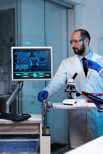 Scientists working In laboratory genetic infection for rare disease. Chemists in pharmaceutical lab examining sample for medical experiment with technology for medicine industry.